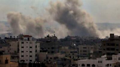 Smoke rises from an Israeli missile strike on a target in Gaza City. Israeli aircraft kept up a relentless string of assaults on Hamas-ruled Gaza, smashing a government complex, security installations and the home of a top militant commander as thousands of Israeli ground troops, backed by tanks and artillery, massed along the border, waiting for a signal to attack. (AP Photo/K) *** Local Caption *** JRL132_MIDEAST_ISRAEL_PALESTINIANS.jpg