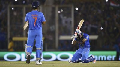 MS Dhoni, Captain of India and Virat Kohli of India celebrate victory during the ICC WT20 India Group 2 match between India and Australia at IS Bindra Stadium on March 27, 2016 in Mohali, India. (Photo by Ryan Pierse/Getty Images)