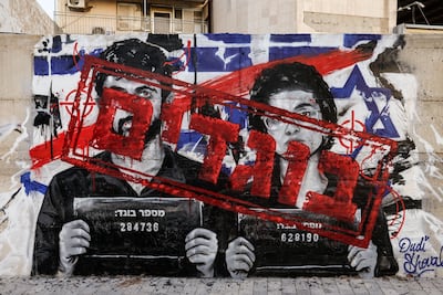 Graffiti depicting the Naza directors, along with the word 'traitors' in Hebrew, in Ashdod, southern Israel. Reuters