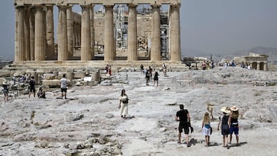 Tourists have started trickling in to the ancient Acropolis archeological site in Athens this month. AFP