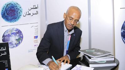 Author Ahmedin Jemal with the first copies of the Arabic-language Arabic Cancer Atlas at the launch in Washington DC. Courtesy: UAE Embassy
