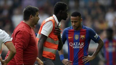 Barcelona's Andes Iniesta is carried off on a stretcher after an injury during the Spanish Primera Liga match against Valencia at the Mestalla on Saturday, October 22, 2016. Manu Fernandez / AP Photo