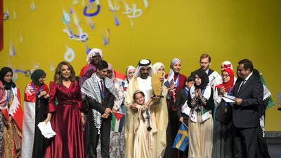 Sheikh Mohammed bin Rashid with the grand winner Maryam Amjoun of Morocco. Leslie Pableo for The National