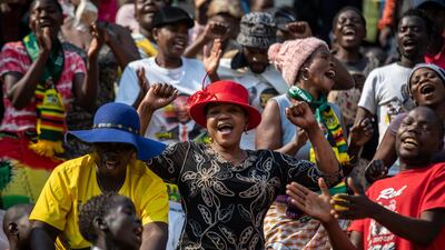 Members of the public sing as they gather in the stands for the funeral service of former president Robert Mugabe at the National Sports Stadium in the capital Harare, Zimbabwe. African heads of state and envoys are gathering to attend a state funeral for Mugabe, whose burial has been delayed for at least a month until a special mausoleum can be built for his remains. AP Photo