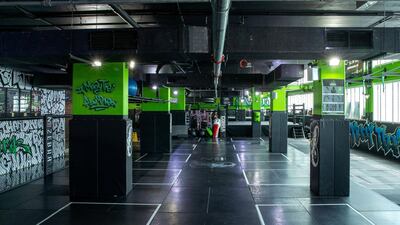 2x2-metre squares are marked out at Cobra Fitness Abu Dhabi in Al Bandar to keep people apart while they exercise. Victor Besa / The National