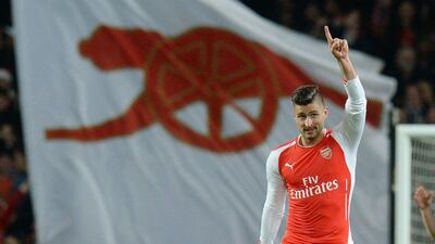 Arsenal's Olivier Giroud celebrates after scoring a one of his two goals in his side's 4-1 Premier League victory over Newcastle United on Saturday in London. Facundo Arrizablaga / EPA / December 13, 2014