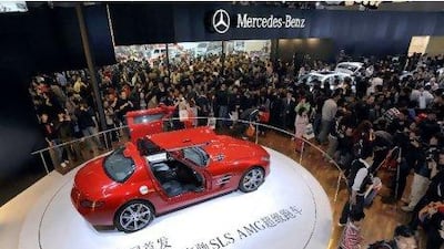 People visit the German auto maker Mercedes Benz booth at the Beijing International Automotive Exhibition on April 25, 2010. The auto show, covering an area equivalent to nearly 40 football pitches, also features 65 concept cars and 95 alternative-energy vehicles. AFP PHOTO / LIU Jin *** Local Caption *** 378877-01-08.jpg