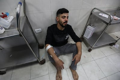 A Palestinian man who was injured in an Israeli airstrike is treated at Nasser Medical Hospital on December 17, 2023 in Khan Younis, Gaza. Getty Images