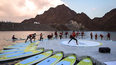The sunset yoga class was run by an instructor in the centre of the dam's waters