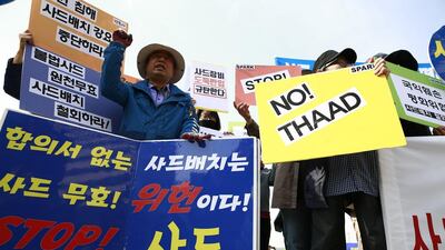 South Korean protesters display placards during a rally held to demand the removal of the US military's Terminal High Altitude Area Defense (THAAD) system, near the US embassy in Seoul, South Korea, 28 April 2017. Jeon Heon-kyun / EPA