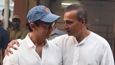 Actor Aamir Khan and businessman Anil Dhirubhai Ambani attend the funeral of Krishna Raj Kapoor. AFP