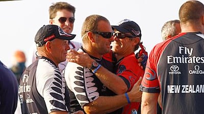 Grant Dalton, left, celebrates with members of Emirates Team New Zealand after winning the Louis Vuitton Trophy.