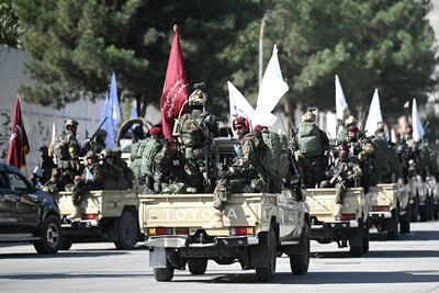 Taliban fighters travel near the site of the US embassy in Kabul, as the group celebrates the fifth anniversary of its return to power. AFP