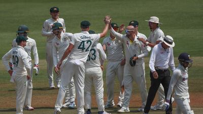 Australia's Nathan Lyon celebrates with teammates following the dismissal of India opener Shubmman Gill, for five. AP