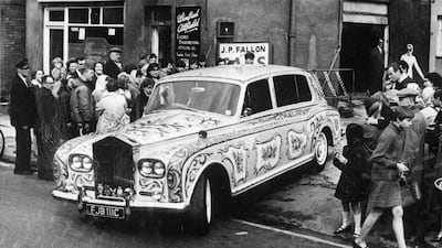 John Lennon's Rolls Royce, decorated with signs of the zodiac and bunches of flowers, in Chertsey, Surrey in 1967.