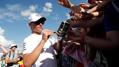 Valtteri Bottas signs autographs for fans ahead of the Hungarian Grand Prix. Reuters