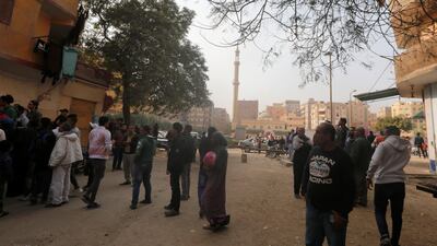 People gather at the site of attack. Amr Abdallah Dalsh / Reuters