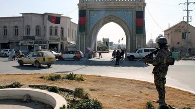 An Afghan soldier stands guard near the Kandahar governor's guesthouse on January 11, 2017, the day after a bombing killed 11 people including five Emiratis. A sixth UAE official, ambassador Juma Al Kaabi, died a month later. Reuters