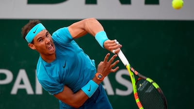 Spain's Rafael Nadal serves to Argentina's Guido Pella during their men's singles second round match. Eric Feferberg / AFP