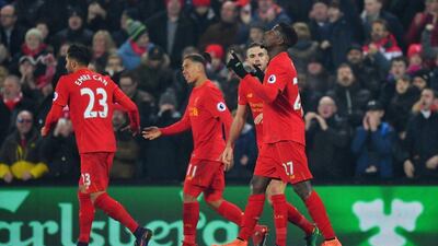 Divock Origi celebrates after scoring Liverpool's opening goal in the 2-0 victory over Sunderland. Dave Howarth / PA