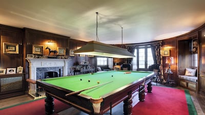 The extensive billiard room is the perfect place to work on defective cue actions. Savills