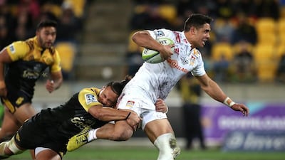 Anton Lienert-Brown, right, of the Chiefs is tackled by Matt Procto of the Hurricanes during the Super Rugby semi-finals match between the Wellington Hurricanes and Waikato Chiefs at Westpac Stadium in Wellington on July 30, 2016. Martin Hunter / AFP