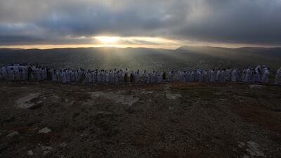 Members of the Samaritan community attend a religious service marking the end of their Passover holiday atop Mount Gerizim, above the West Bank city of Nablus. EPA