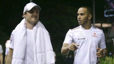 Lewis Hamilton, right, will partner Nico Rosberg, left, at Mercedes-GP next season.
