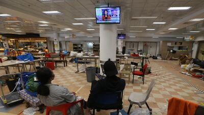 Protesters watch TV inside the campus. AP Photo