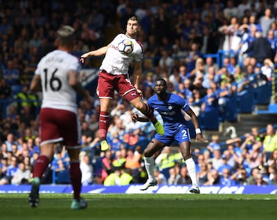 Burnley's Sam Vokes, centre, in action against Chelsea. Facundo Arrizabalaga / EPA