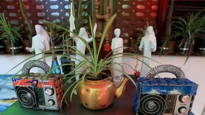 Knick-knacks made from recycled materials decorate the interior of the Art House Cafe in Abu Dhabi. Ravindranath K / The National