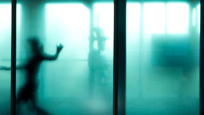 A speedskater stretches as she warms up in a gym prior to races of the Speedskating World Cup at the Thialf ice rink in Heerenveen, Netherlands. Peter Dejong / AP Photo