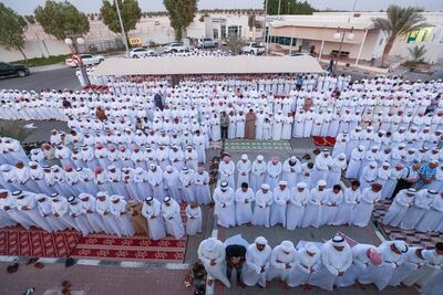 Funeral prayers are carried out for the family of Ali Al Ketheri. Victor Besa / The National