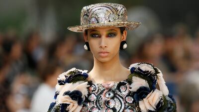 Every square inch of this Chanel look is hand covered in dense sequins and chiffon petals. Photo by Gonzalo Fuentes / Reuters