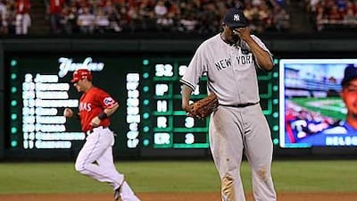 Josh Hamilton of the Texas Rangers rounds the bases on his three-run homer in the bottom of the first inning against CC Sabathia.