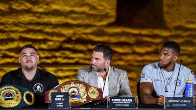 Andy Ruiz Jr, left, Eddie Hearn, centre, and Anthony Joshua during a press conference for "Clash on the Dunes". AFP