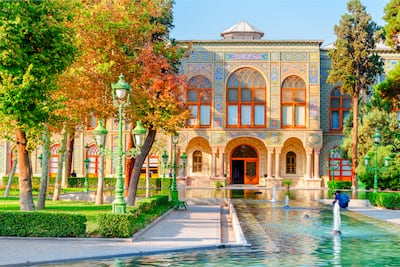 Golestan Palace garden in Tehran features an ornate tilework facade. Getty Images
