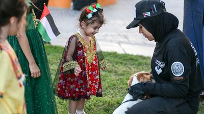 Children meet a police dog and its handler at the library event