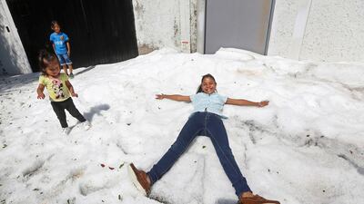Residents play on top of ice after a heavy storm of rain and hail which affected Guadalajara, Mexico. Reuters