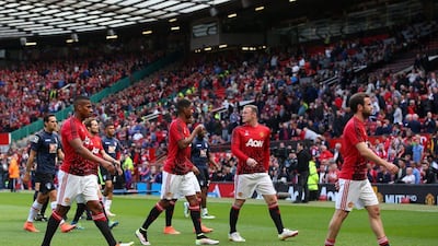Wayne Rooney of Manchester United leaves the field with team mates before the match was abandoned prior to the Premier League match between Manchester United and AFC Bournemouth at Old Trafford on May 15, 2016 in Manchester, England. (Alex Livesey/Getty Images)