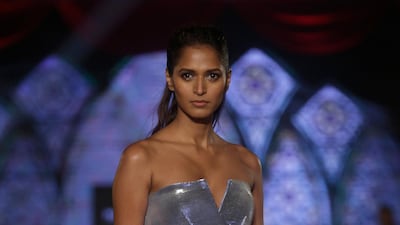 Embellishment aside, the designer also looked to shiny fabrics. AP Photo