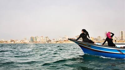 Tanya Habjouqa took this image of two women in Gaza celebrating their school graduation before the current war. Because of restrictions on how far at sea they could travel, their boat ride was joyous but short.