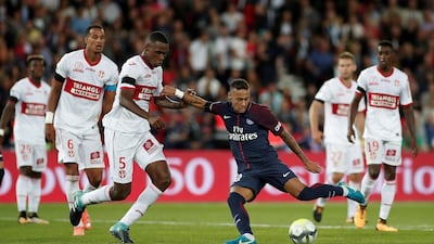 Paris Saint-Germain striker Neymar, centre, scores his side's final goal to cap a 6-2 win over Toulouse. Benoit Tessier / Reuters