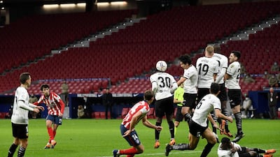 Atletico Madrid's Portuguese midfielder Joao Felix shoots a free kick. AFP