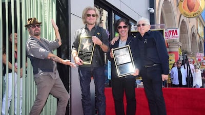 From left: Dave Stewart of Eurythmics with Daryl Hall and John Oates, plus former Atlanta Records president label boss Jerry Greenberg, at the unveiling of a star for Hall & Oates on the Hollywood Walk of Fame on September 2. Frederic J Brown / AFP