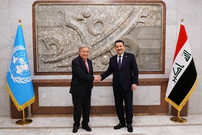 Iraqi PM Mohammed Shia Al Sudani shakes hands with Antonio Guterres in Baghdad. AFP