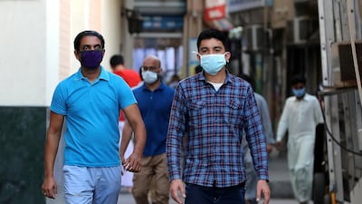 People walking on the streets in Al Ras area in Deira Dubai. Pawan Singh / The National