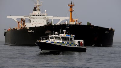 A Royal Gibraltar Police's boat guards the Iranian oil tanker Grace 1 as it sits anchored after it was seized earlier this month by British Royal Marines off the coast of the British Mediterranean territory on suspicion of violating sanctions against Syria, in the Strait of Gibraltar, southern Spain. REUTERS