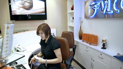 United Arab Emirates - Dubai - July 28, 2010.BUSINESS: Customer care representative Janeth Rhodora (cq-al) tends the reception area at VLCC Slimming, Skin & Hair Services, a popular South Asian wellness chain, located in Al Dana Center in Deira, Dubai on Wednesday, July 28, 2010. Amy Leang/The National