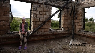 Widow Lubov Doroshenko, 67, returns to her destroyed home in 2023 in Bohorodychne. Getty Images
